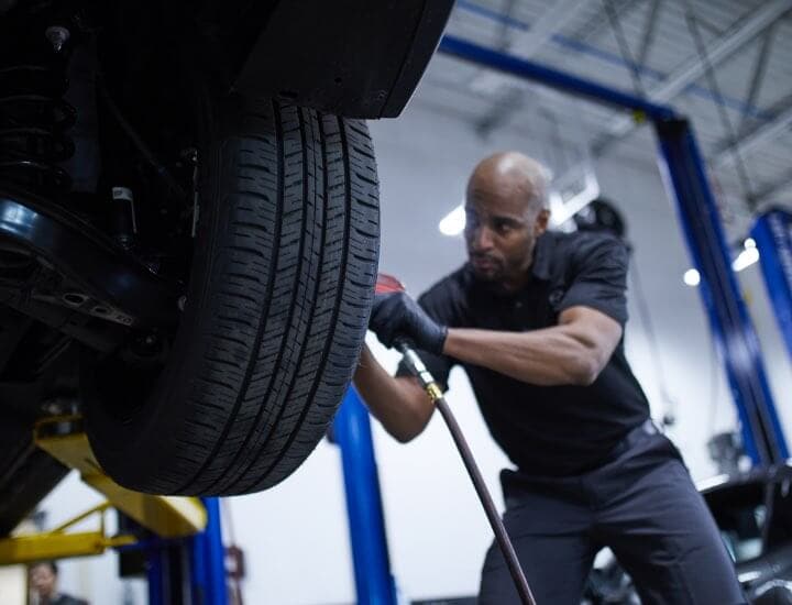 Technician installing tire