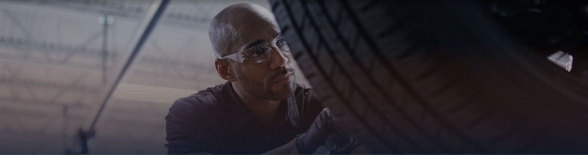 Technician installing tire